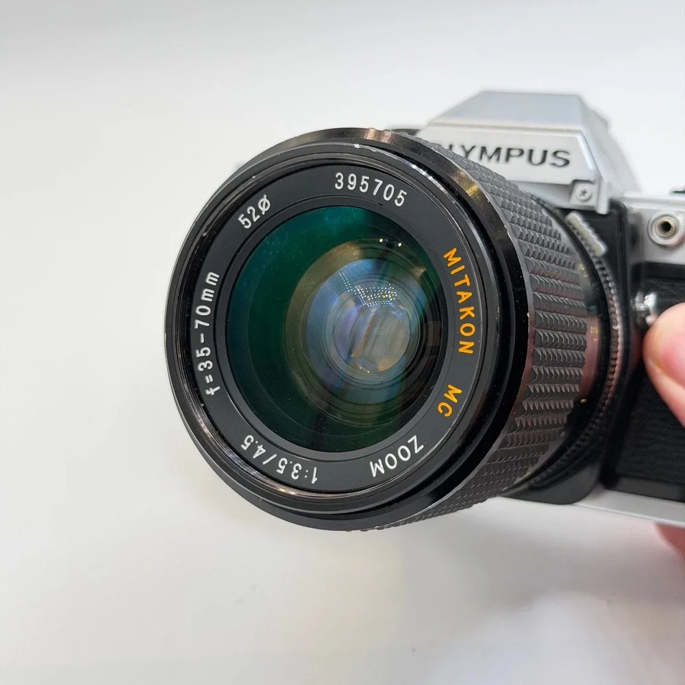 Olympus OM10 35mm Film SLR Camera Silver with Mitakon 35-70mm Zoom Lens Japan